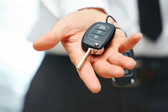 Person holding car keys